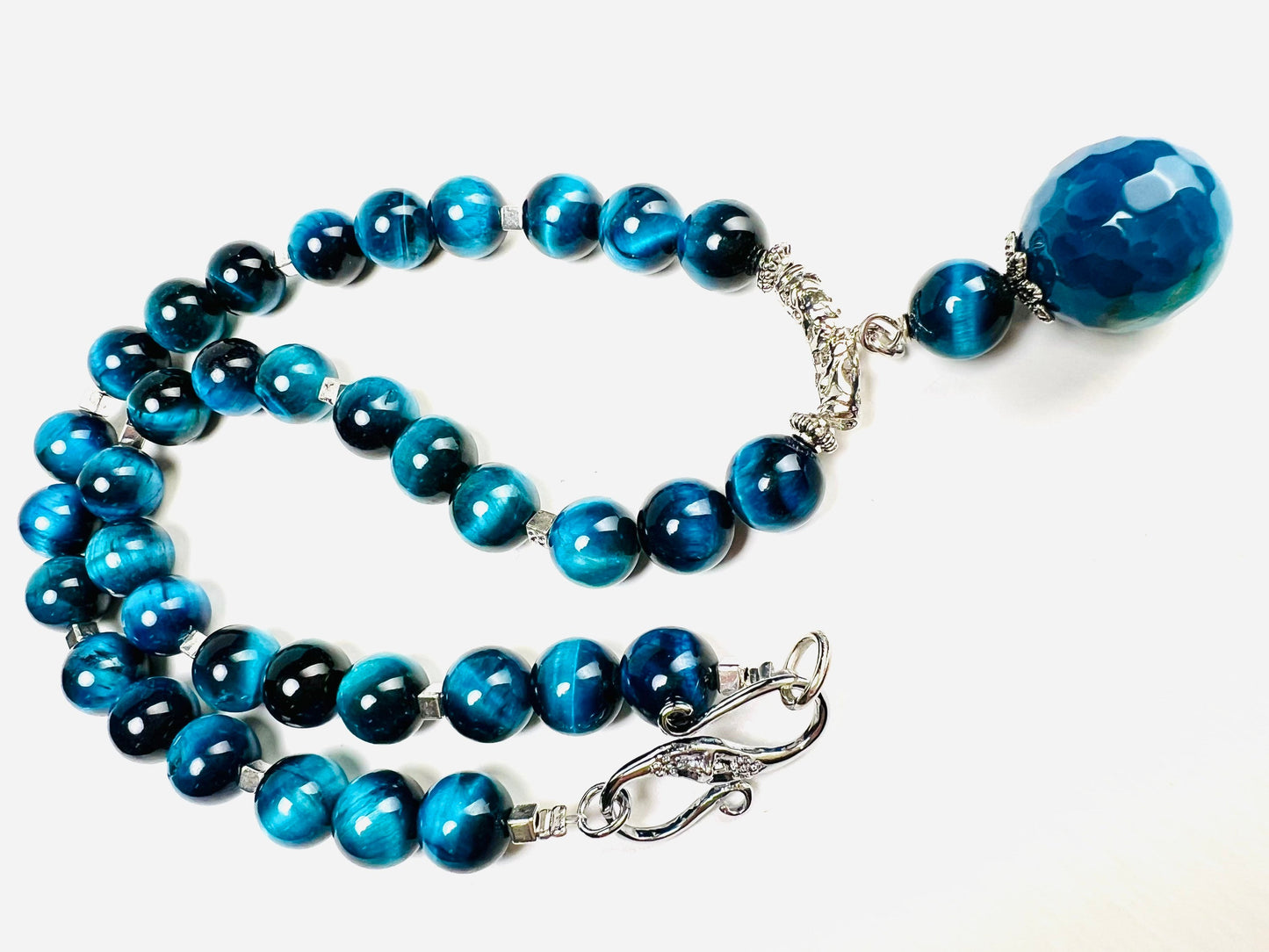 Blue Tiger Eye 8mm smooth round AAA with matching blue fire agate 18mm pendant rhodium S hook clasp 18” necklace. Energy and strength.