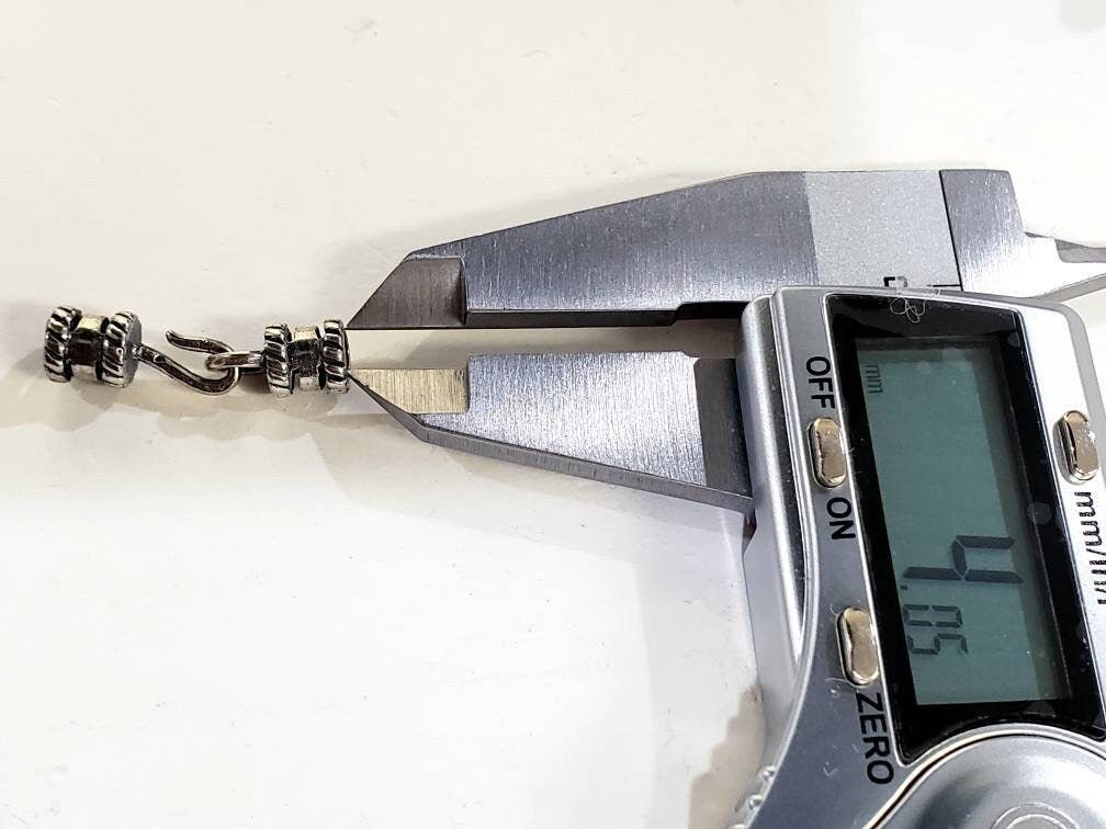 925 Sterling Silver Antique finished Leather end cap bails .Inside diameter 4mm to fit 3, 4mm thick leather,cord .Crimp in the middle,1 set