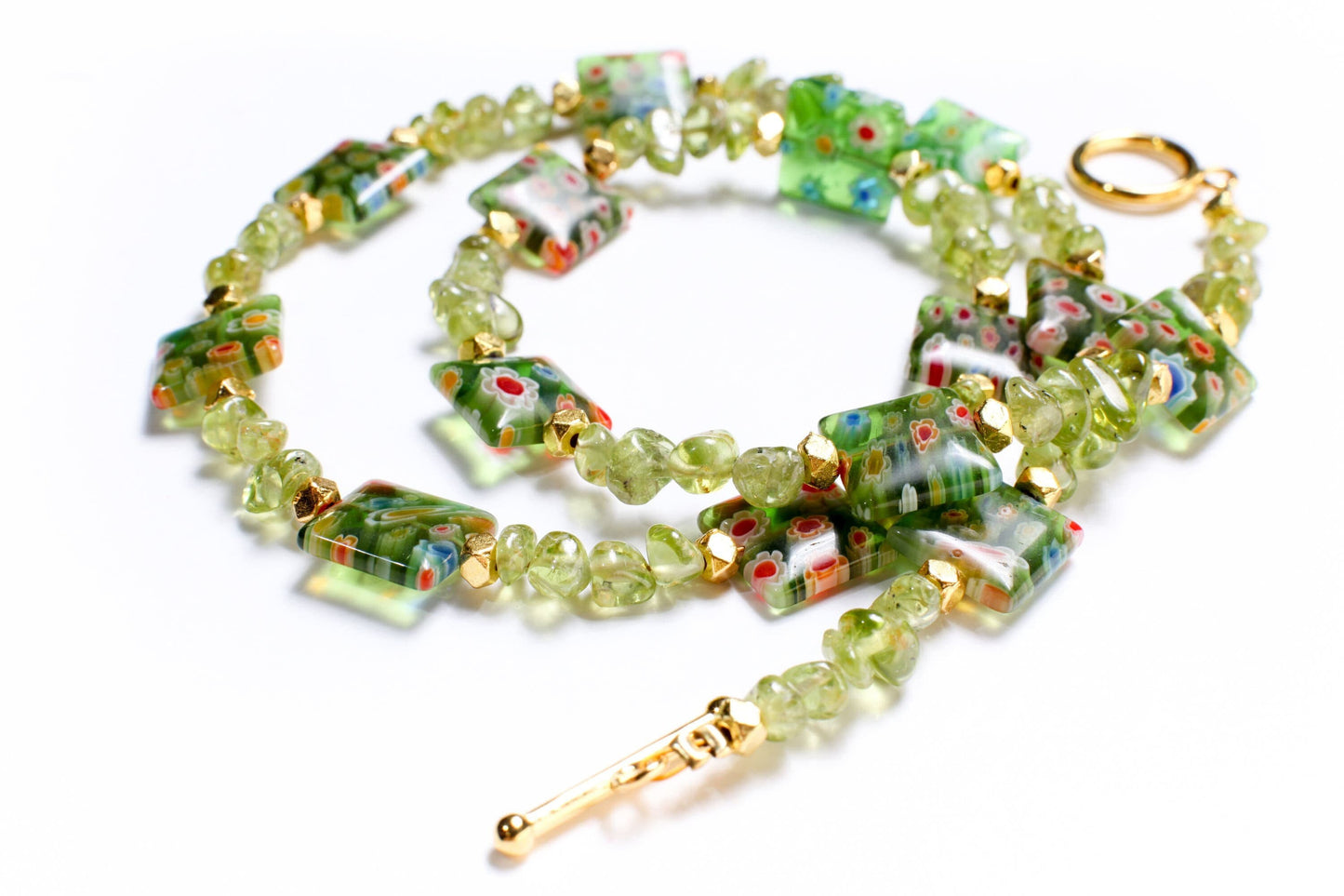 Natural Raw Peridot Tumbled Nugget 4x6-5x7mm Gemstone. Spacer pillow shape Millefiori thousand Flower bead 12mm Gold Toggle Clasp Necklace