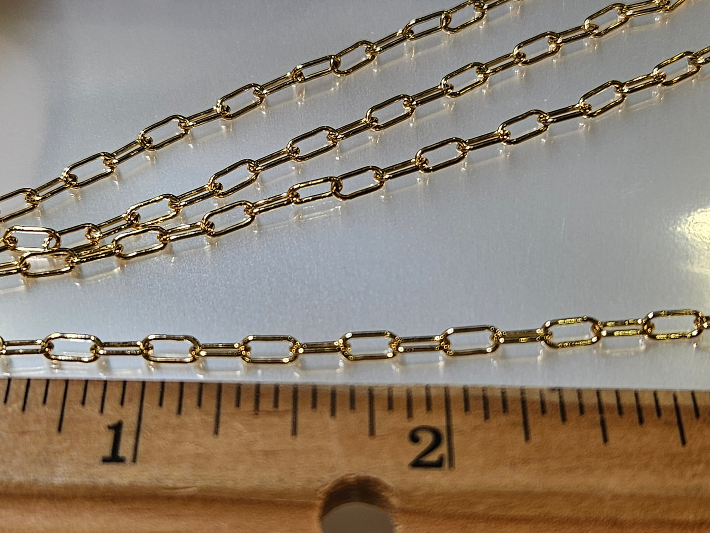 14K Gold Filled Paper Clip Chain 3x8mmJewelry Making Italian Chain by foot. 14/20 gold filled. High quality 2 gram each foot weight .