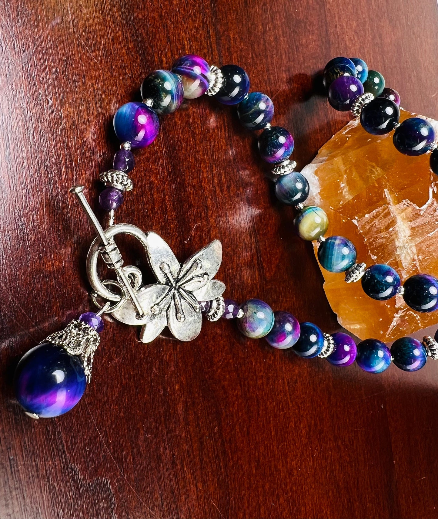 Galaxy Tiger Eye 8mm smooth round AAA quality with matching pendant Bali style spacer and flower toggle necklace. Strength