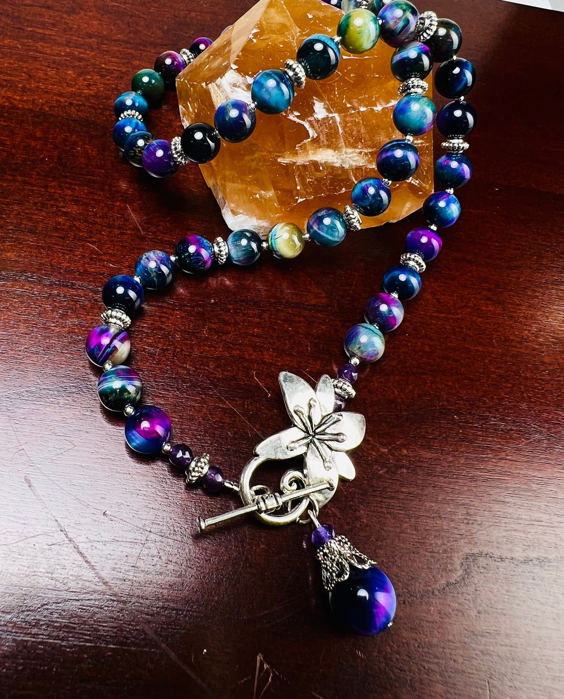 Galaxy Tiger Eye 8mm smooth round AAA quality with matching pendant Bali style spacer and flower toggle necklace. Strength