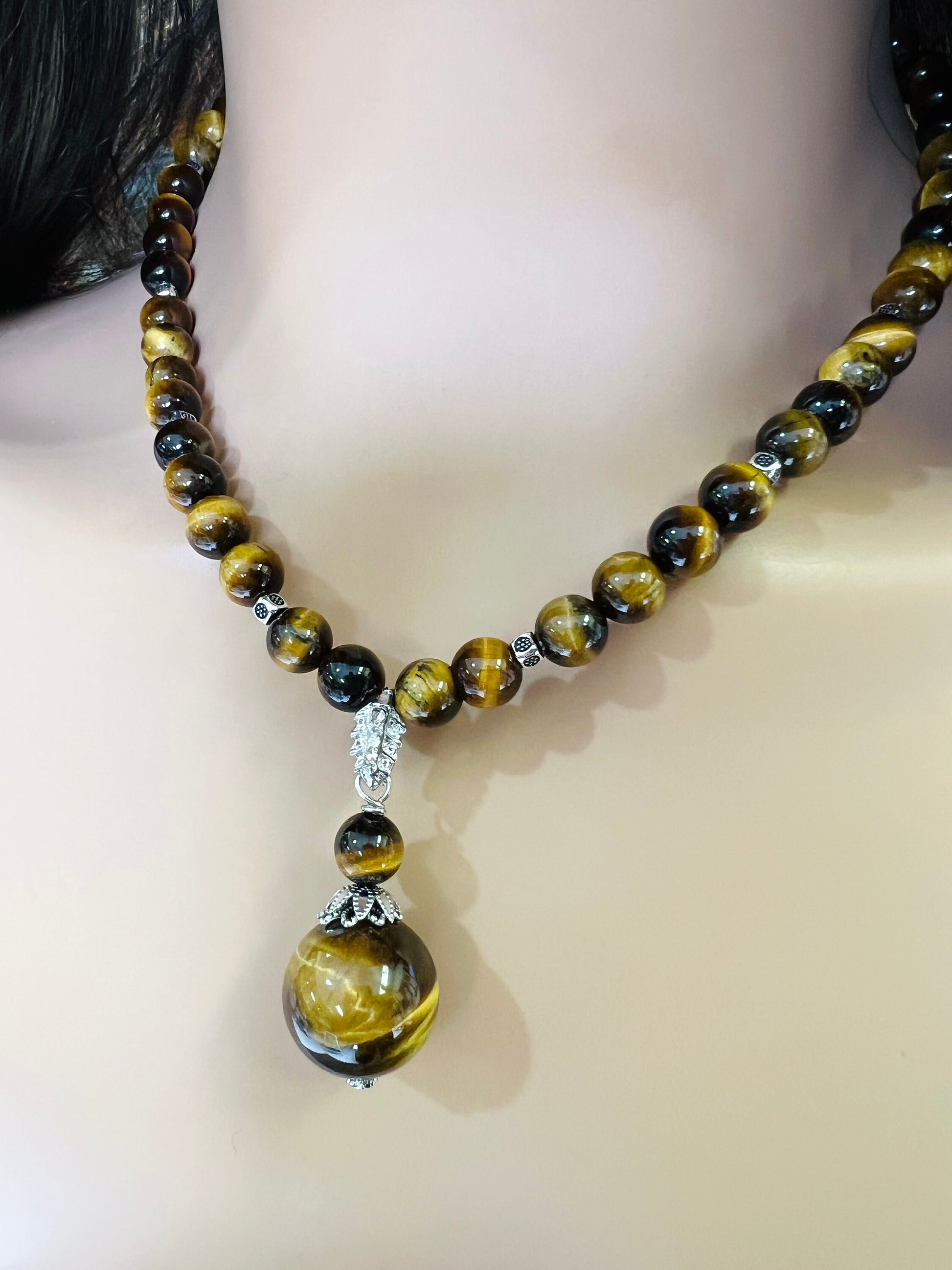 Brown Tiger Eye 8mm smooth round AAA with matching tiger eye 18mm pendant rhodium silver spacer and S hook clasp 18” necklace