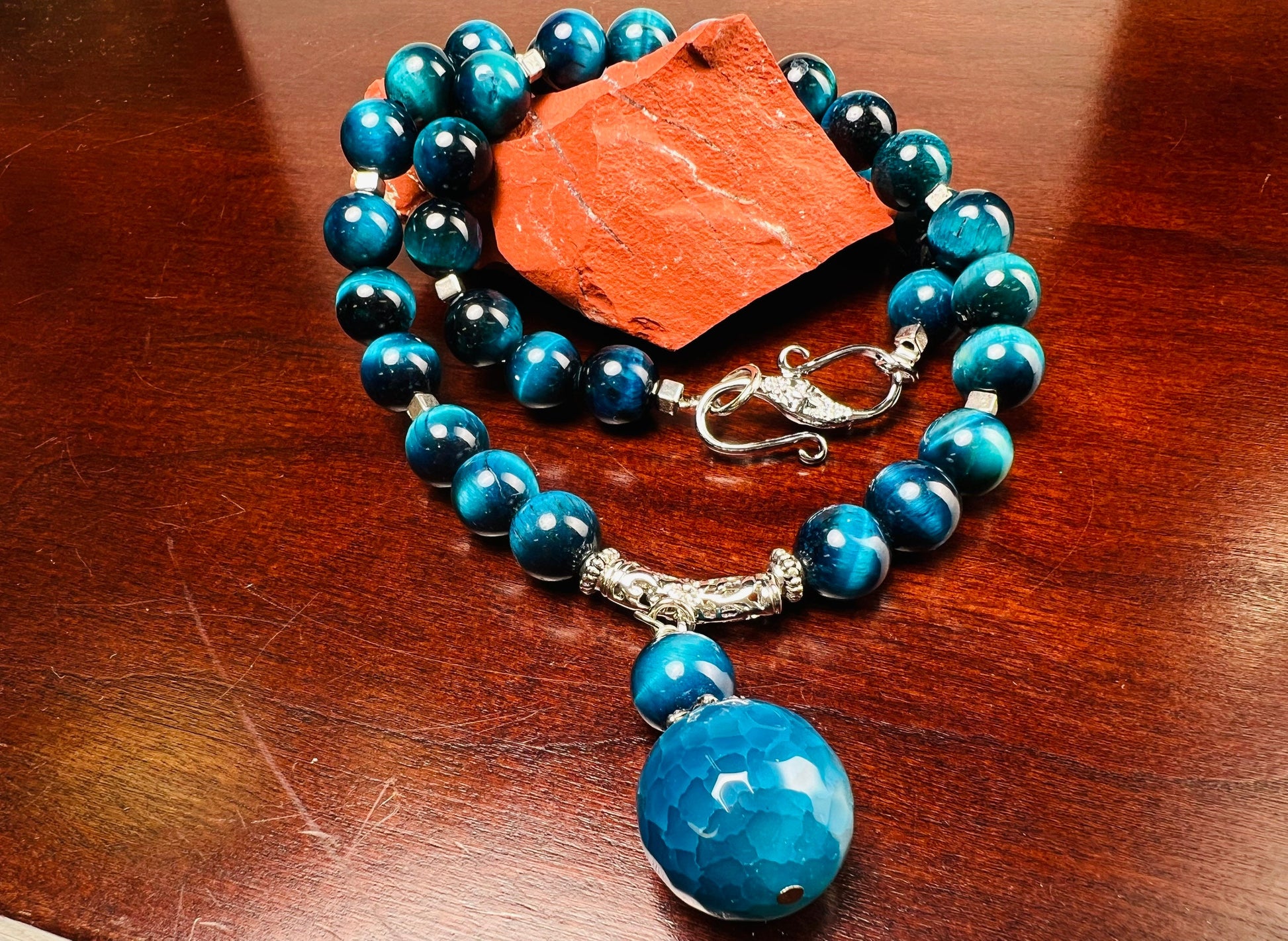 Blue Tiger Eye 8mm smooth round AAA with matching blue fire agate 18mm pendant rhodium S hook clasp 18” necklace. Energy and strength.