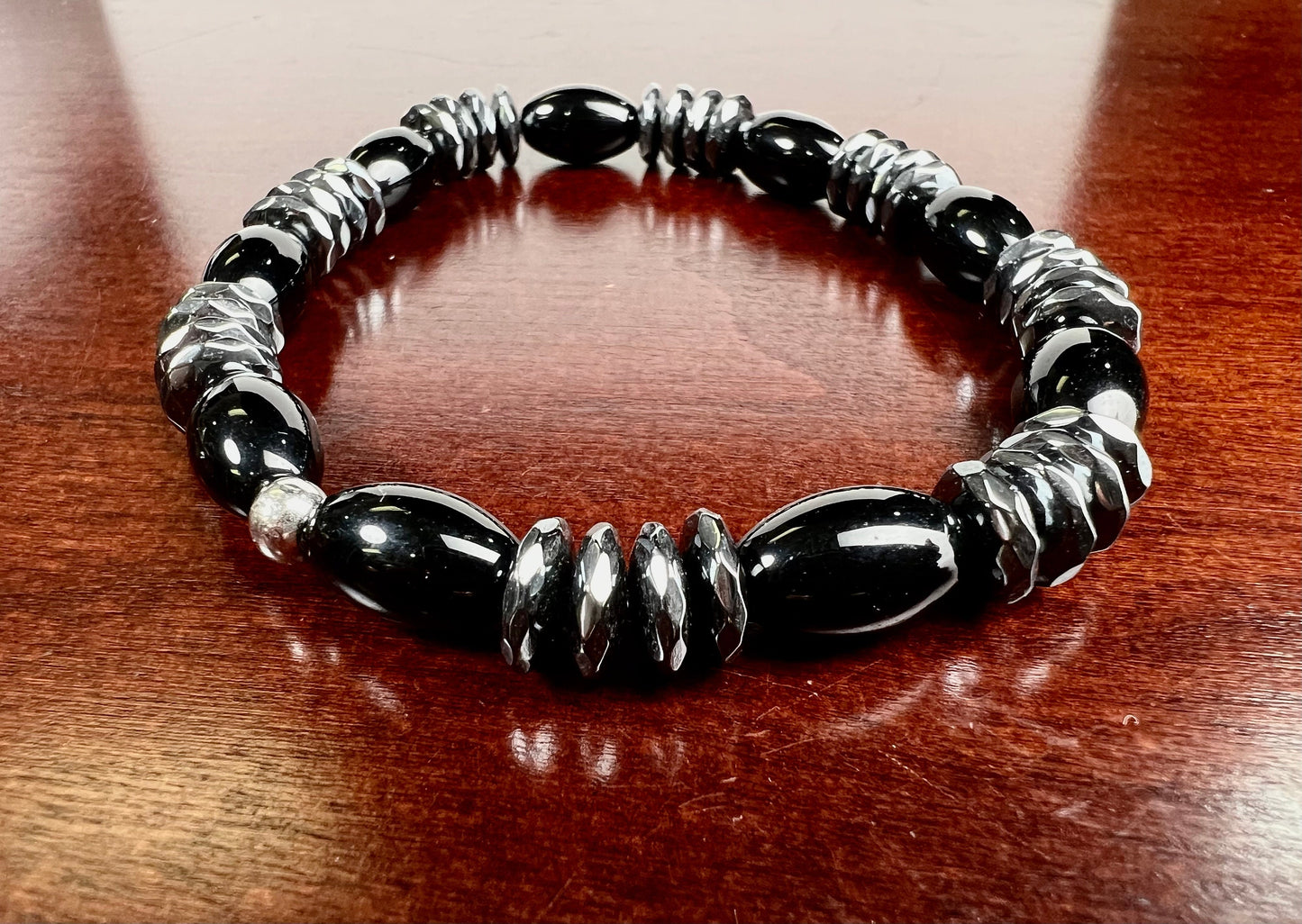 Black Onyx smooth oval with 10mm hematite faceted disc roundel AAA quality beaded Stretchy Bracelet. Man’s gift energy protection strength