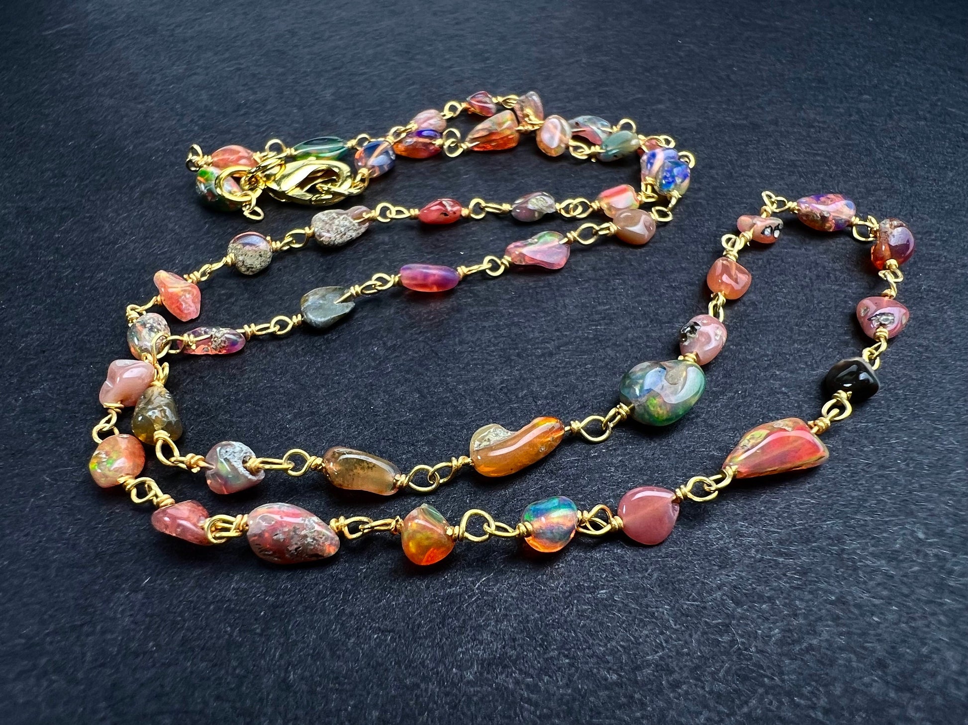 Genuine Ethiopian Fire opal welo opal wire wrapped handmade chain in 22k gold vermeil .