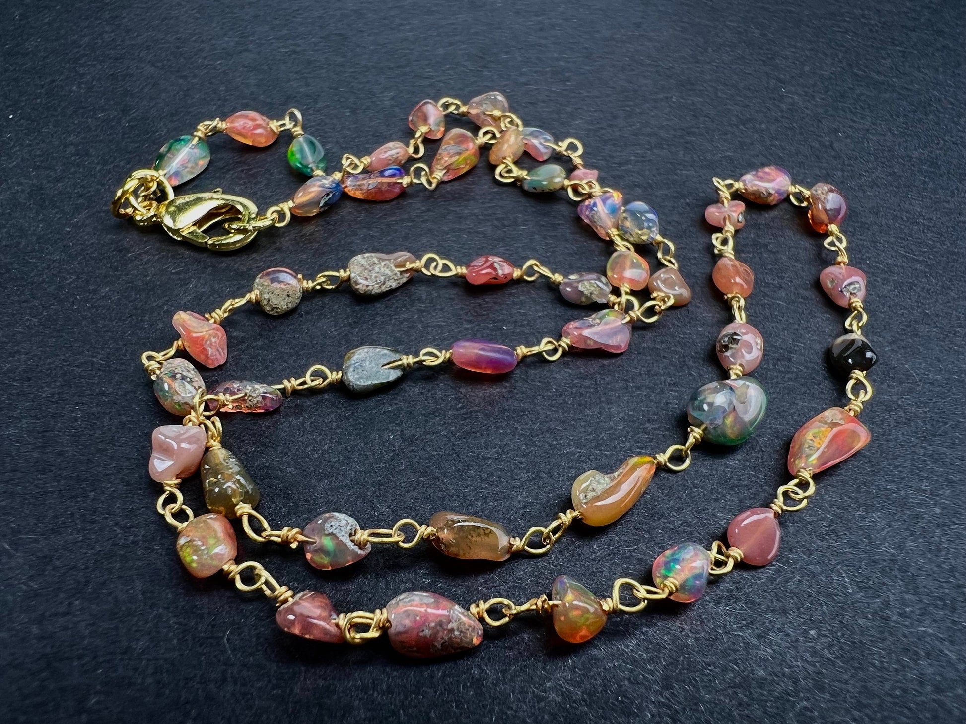 Genuine Ethiopian Fire opal welo opal wire wrapped handmade chain in 22k gold vermeil .