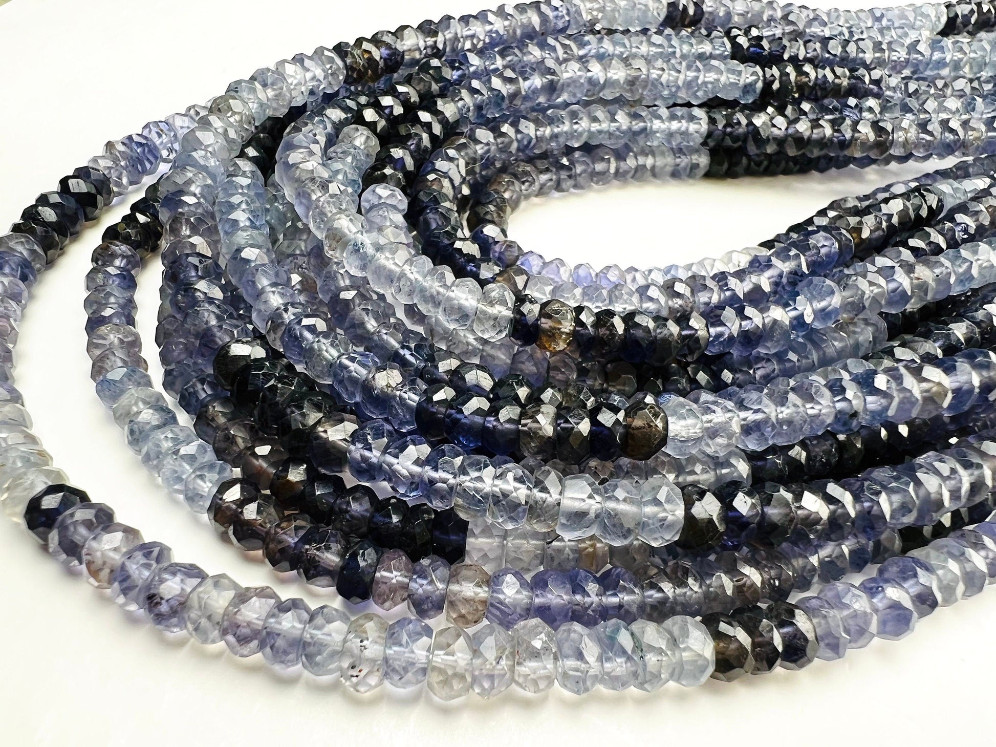 Natural Ombre Iolite Shaded 5mm large faceted Roundel Iolite rare 8” and 16” strand . Beautiful water blue shaded iolite beads .