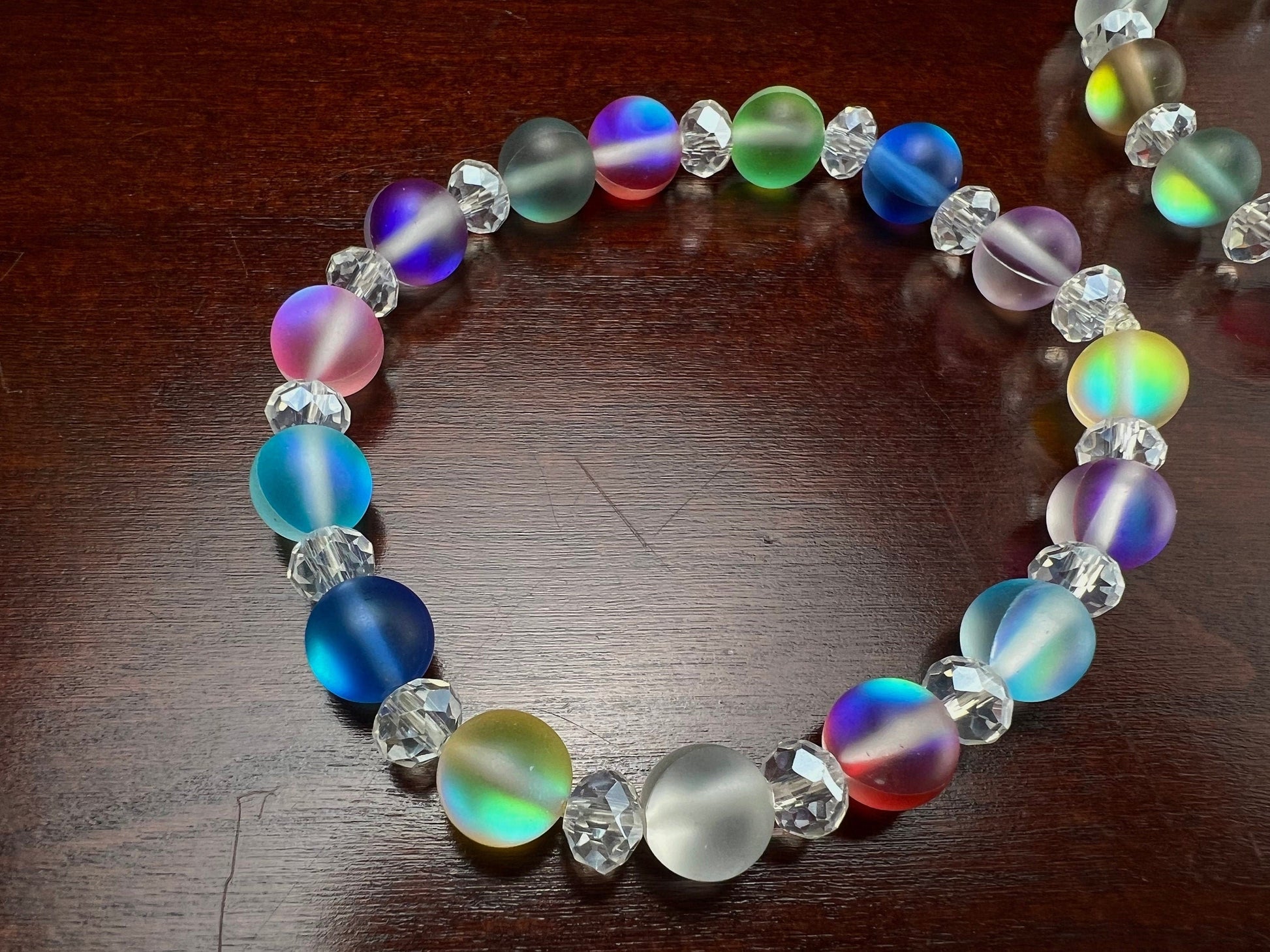 Multi color Angel Aura Quartz Mermaid Glow bead 8mm Matte smooth round bead accents with sparkly crystal roundel stretchy Bracelet. Rainbow