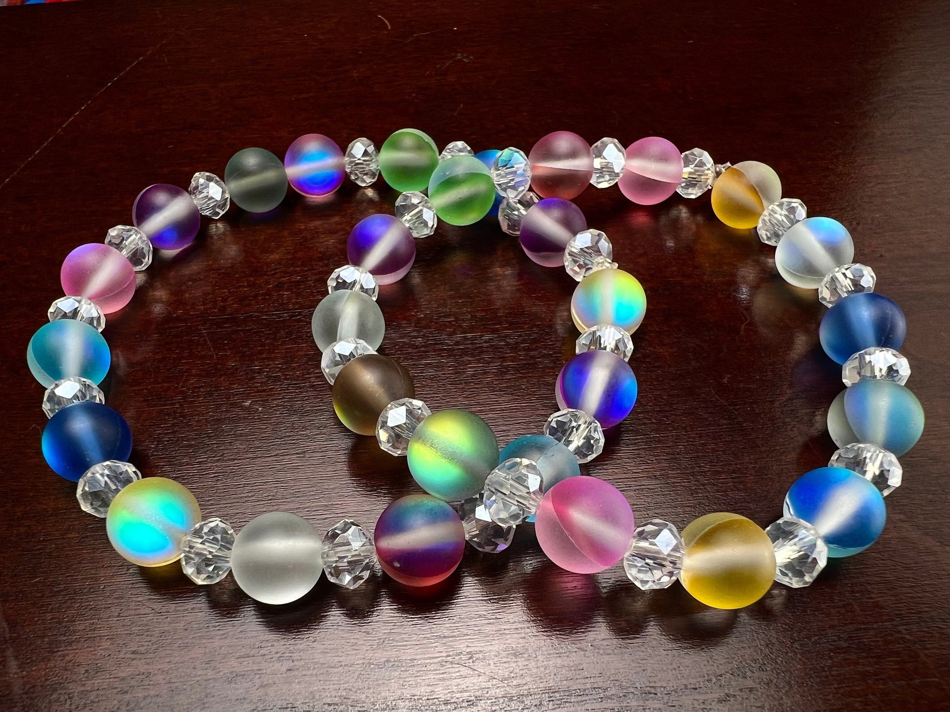 Multi color Angel Aura Quartz Mermaid Glow bead 8mm Matte smooth round bead accents with sparkly crystal roundel stretchy Bracelet. Rainbow