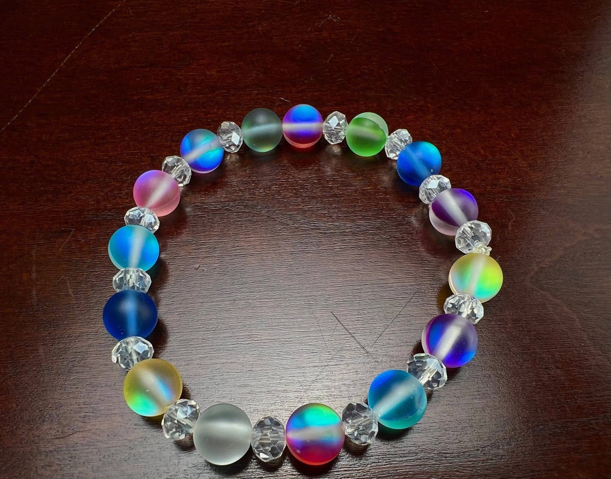 Multi color Angel Aura Quartz Mermaid Glow bead 8mm Matte smooth round bead accents with sparkly crystal roundel stretchy Bracelet. Rainbow