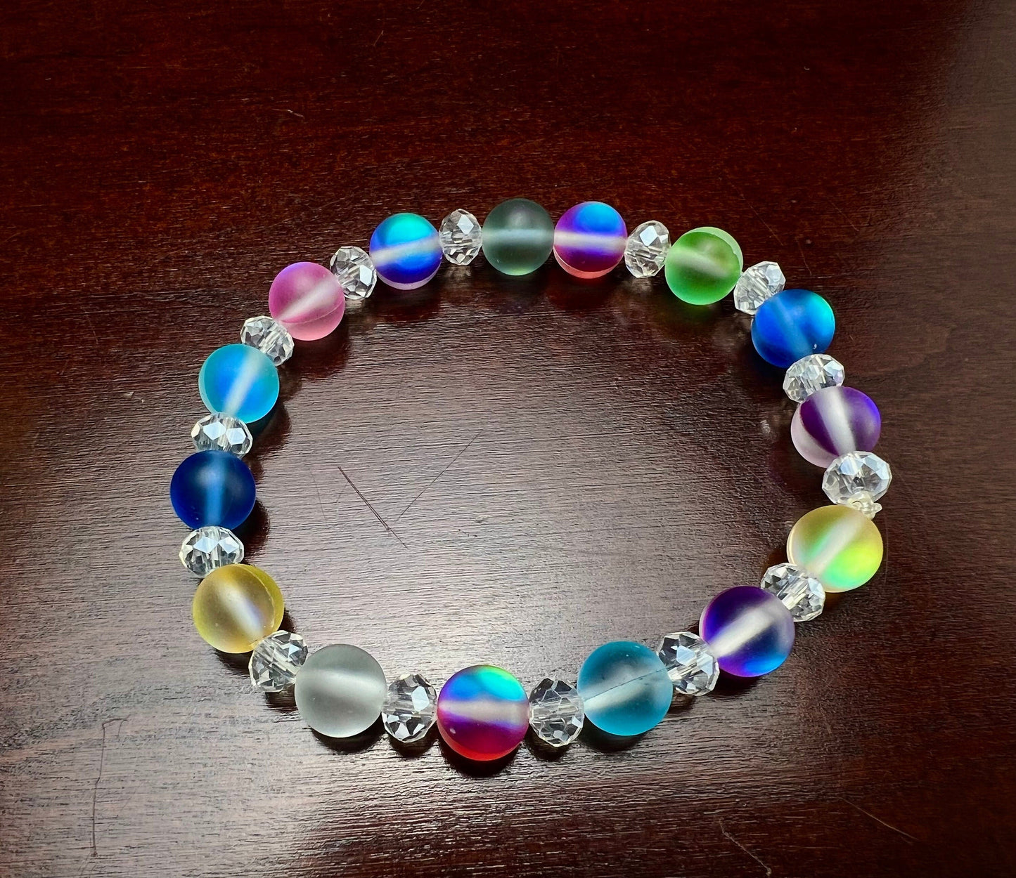 Multi color Angel Aura Quartz Mermaid Glow bead 8mm Matte smooth round bead accents with sparkly crystal roundel stretchy Bracelet. Rainbow