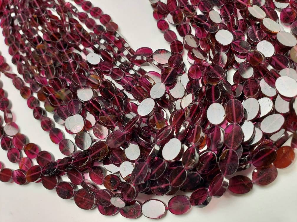 Mozambique Garnet flat Oval 8-9mm beads 14” full strand . Single or bulk close out price