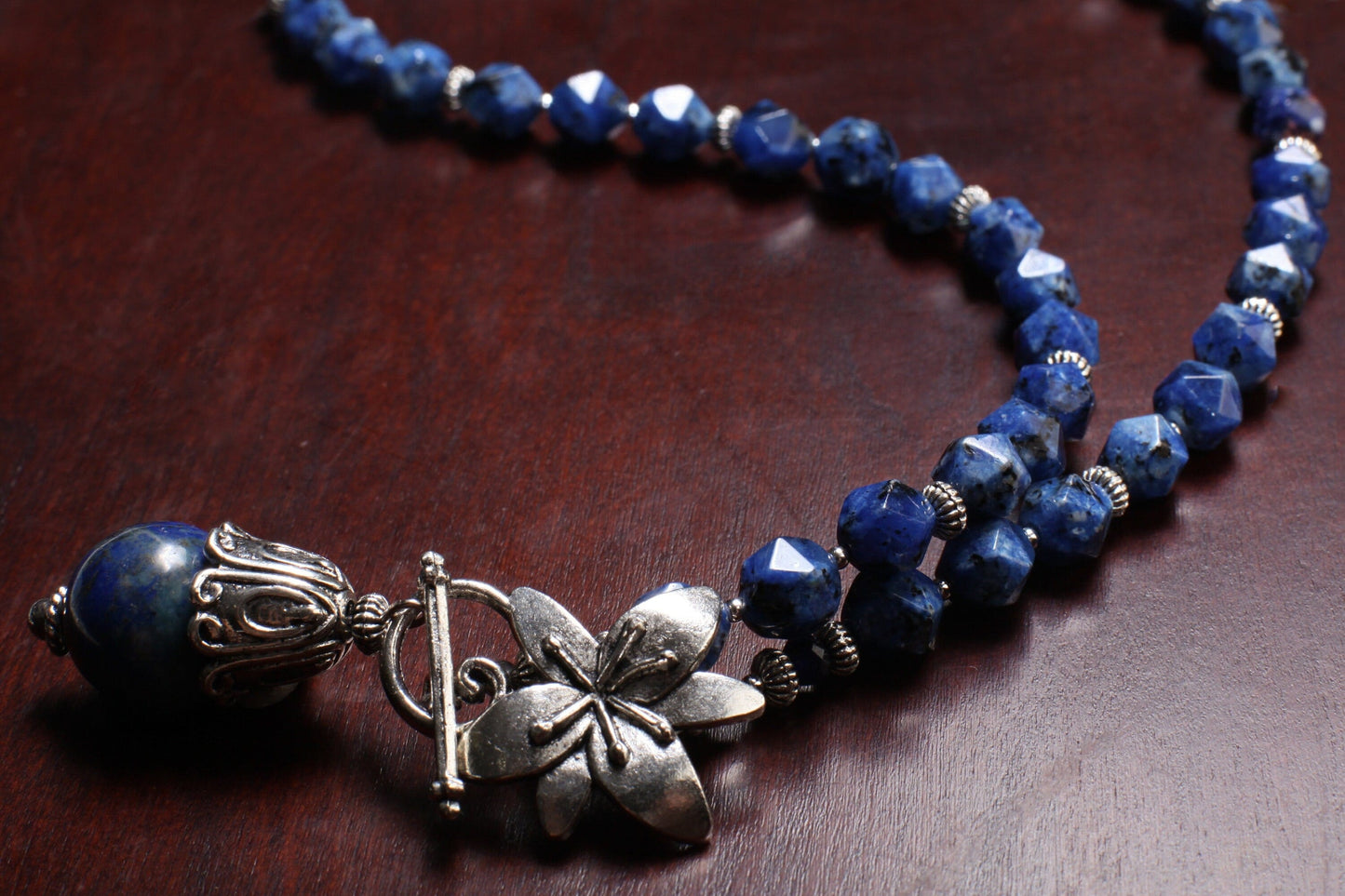 Lapis Lazuli Fancy Cap Pendant with Sodalite Faceted Hexagon Necklace Accented with Bali Style bead and Flower Toggle necklace