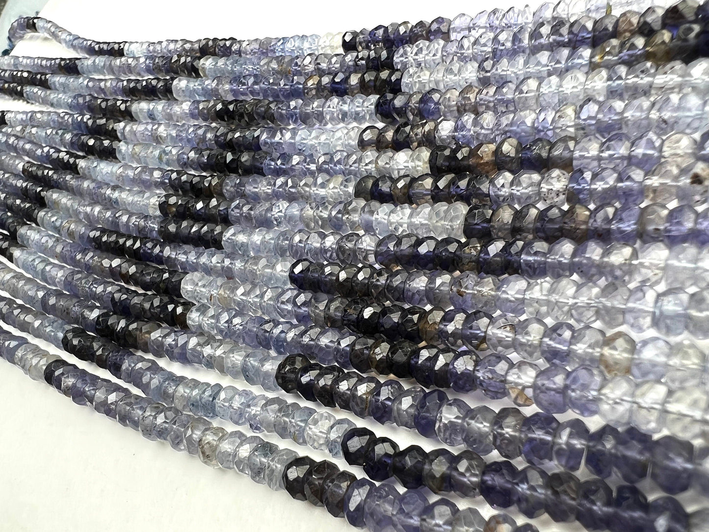 Natural Ombre Iolite Shaded 5mm large faceted Roundel Iolite rare 8” and 16” strand . Beautiful water blue shaded iolite beads .