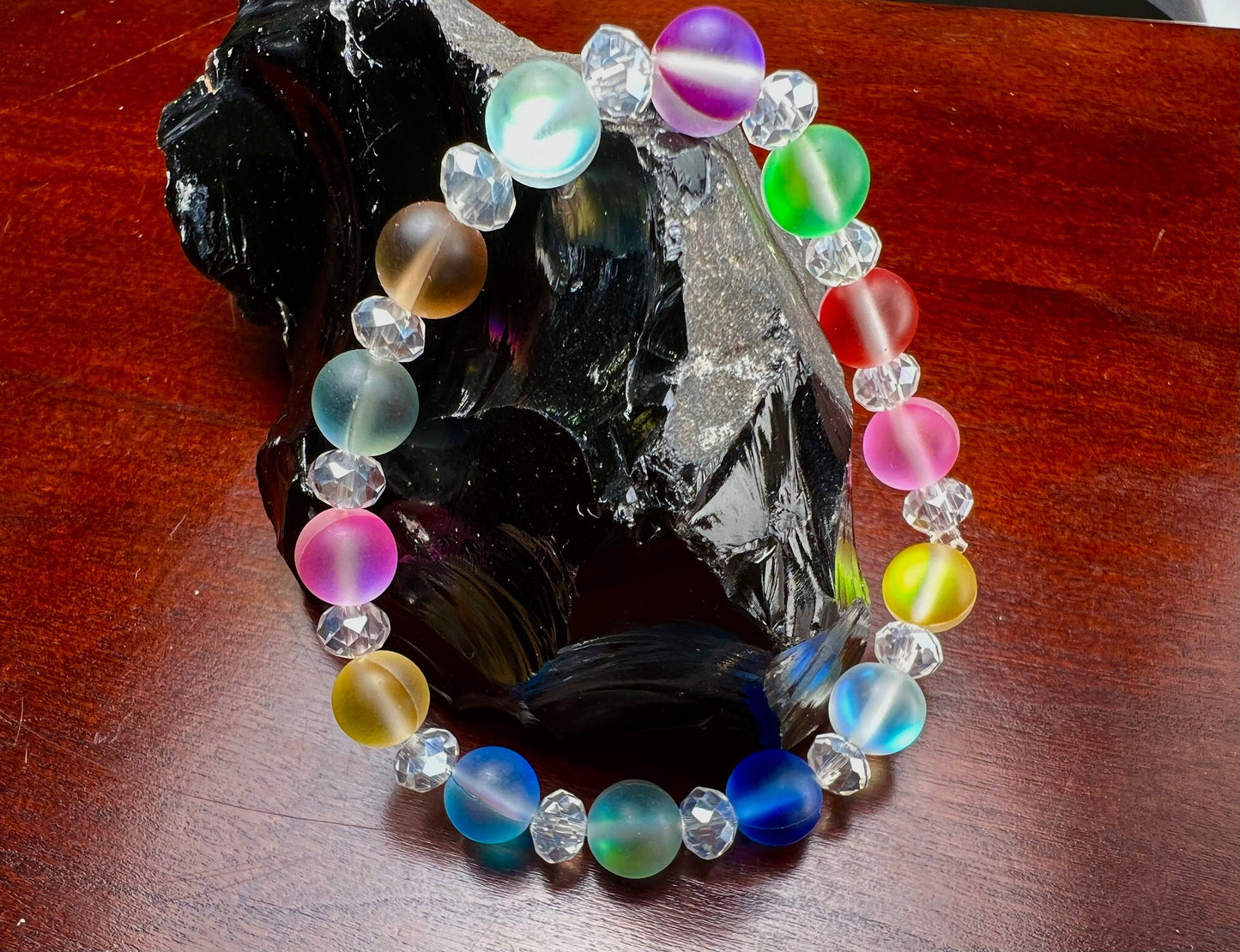 Multi color Angel Aura Quartz Mermaid Glow bead 8mm Matte smooth round bead accents with sparkly crystal roundel stretchy Bracelet. Rainbow