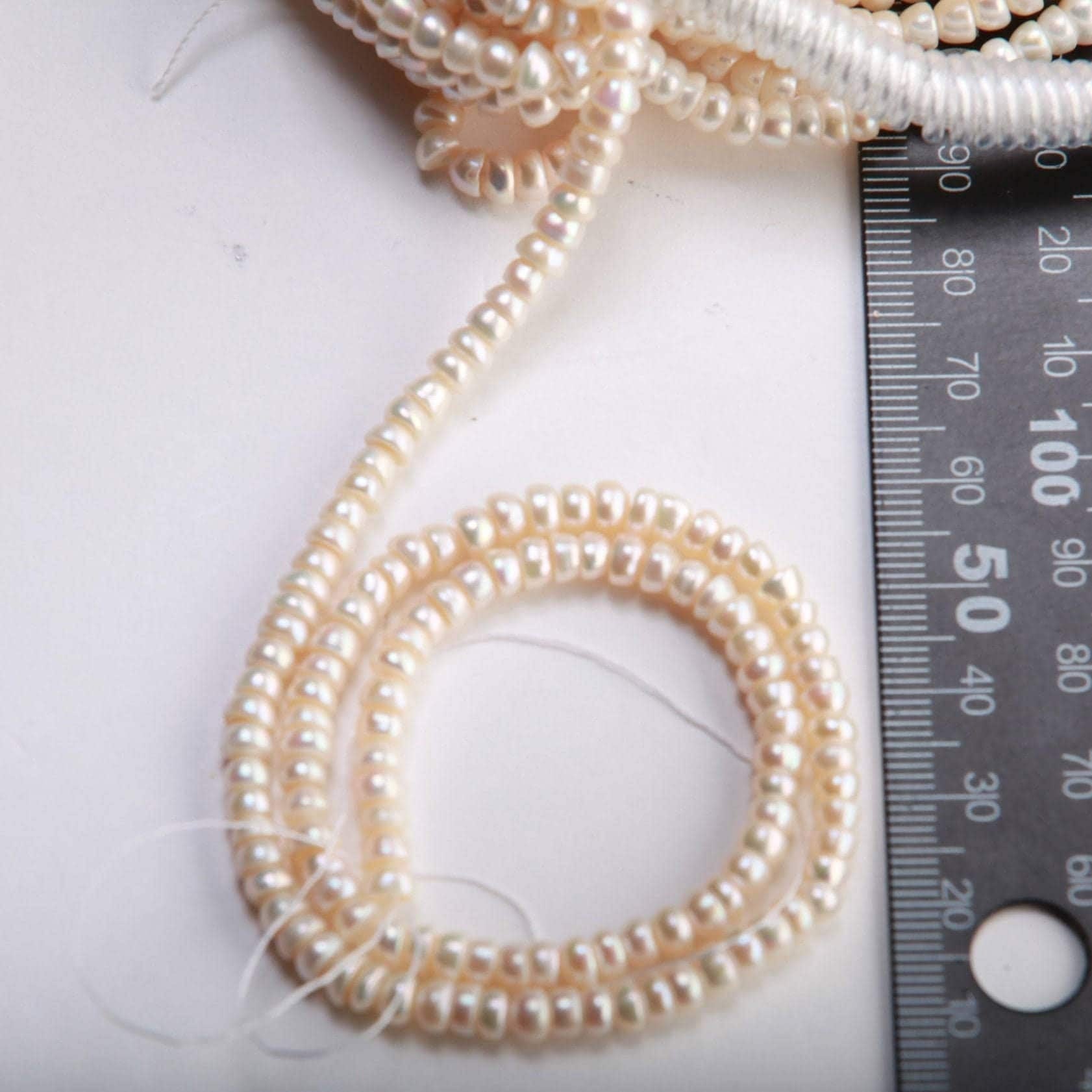 Natural Freshwater Pearl 3x4.5mm Roundel 14” full strand