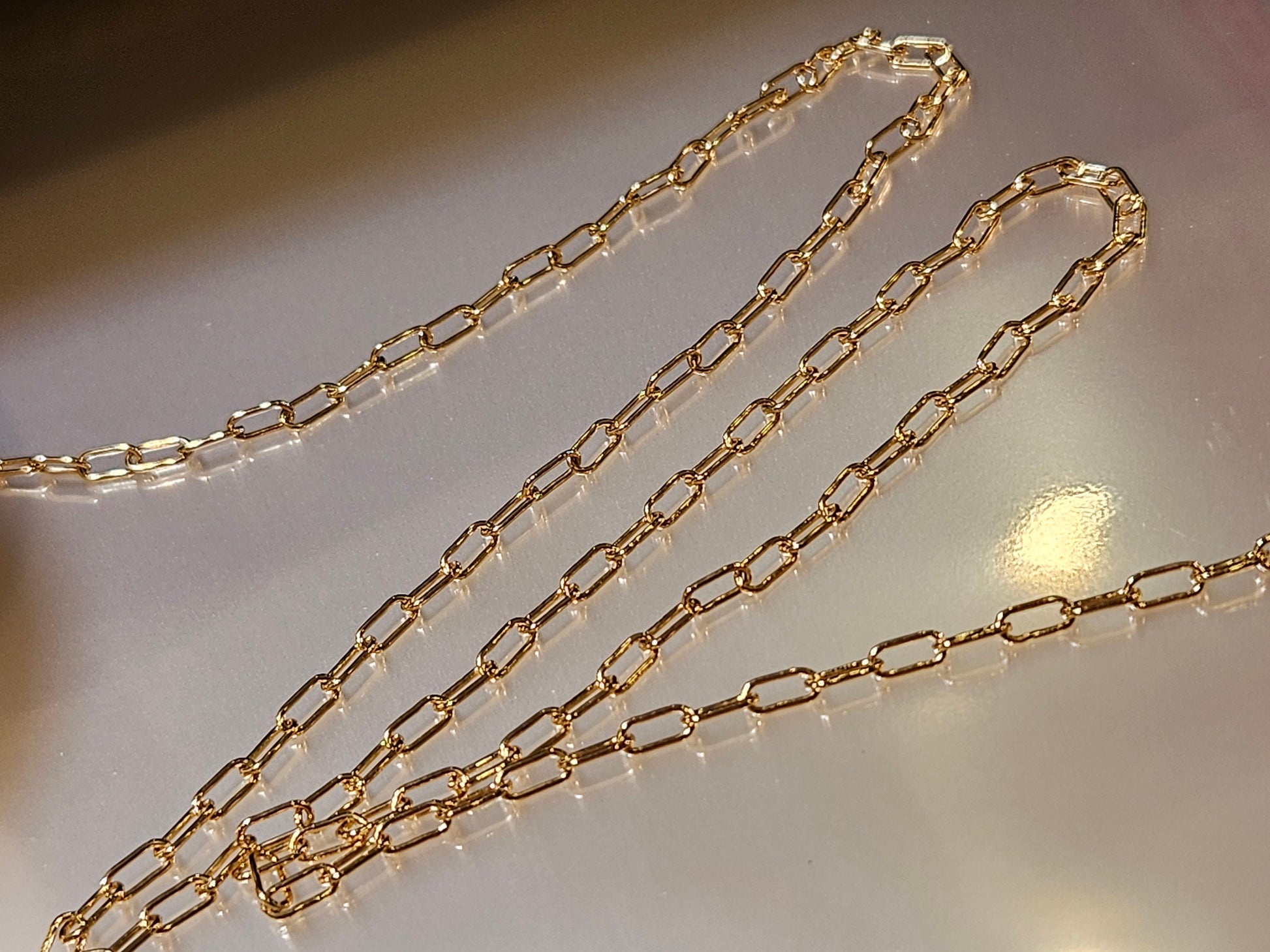 14K Gold Filled Paper Clip Chain 3x8mmJewelry Making Italian Chain by foot. 14/20 gold filled. High quality 2 gram each foot weight .