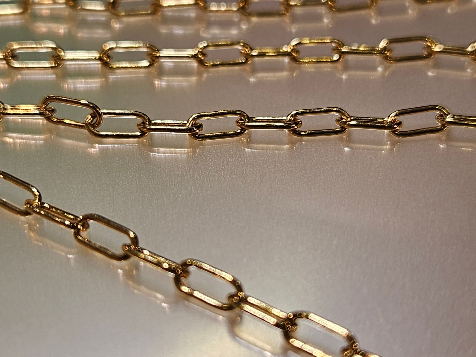14K Gold Filled Paper Clip Chain 3x8mmJewelry Making Italian Chain by foot. 14/20 gold filled. High quality 2 gram each foot weight .