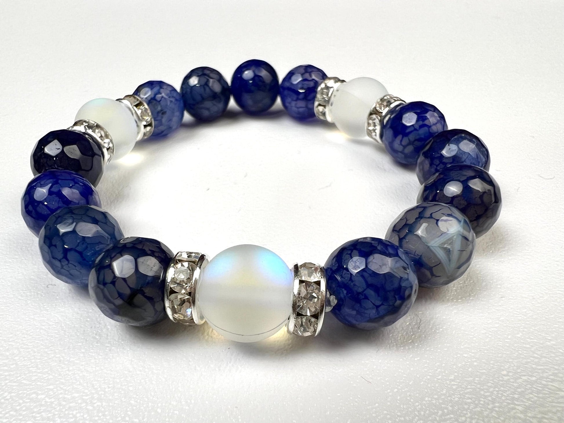 Fire Agate blue faceted 10mm Glass glow bead Rhinestone Spacers stretch Bracelet. Beautiful blue fire agate bracelet gift